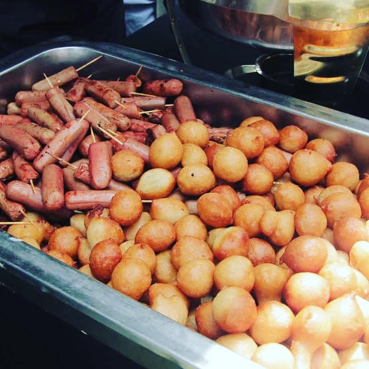 Sausage and puff-puff platter in a serving tray